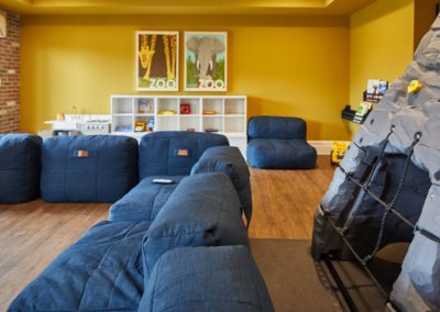 couches and toys in the playroom at the Station at Lyndhurst apartments in NJ